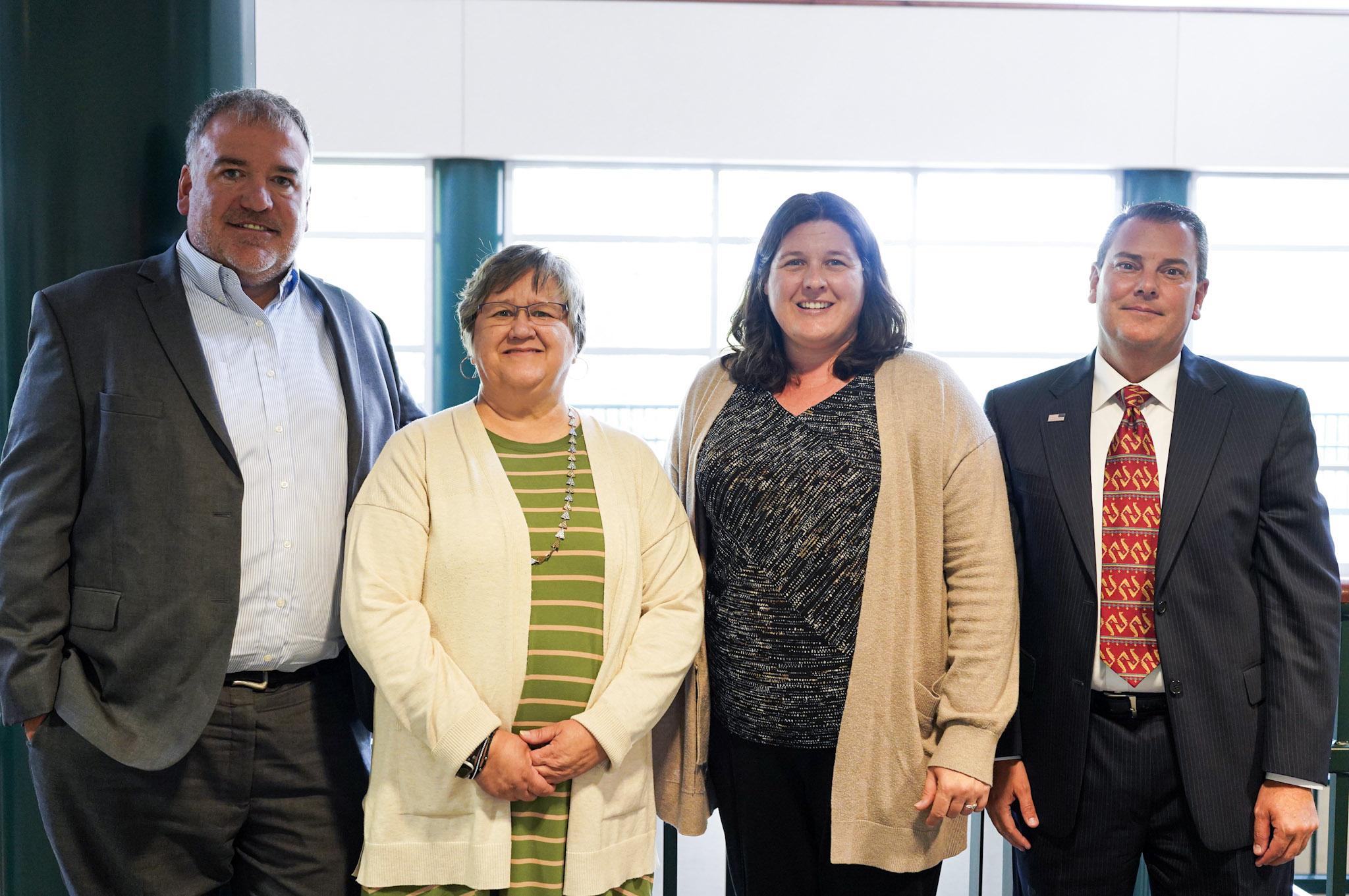 Election officials from Douglas, Lancaster and Saline Counties stand together in Perry Campus Center in Crete after sharing about their work and roles before, during and after elections. 